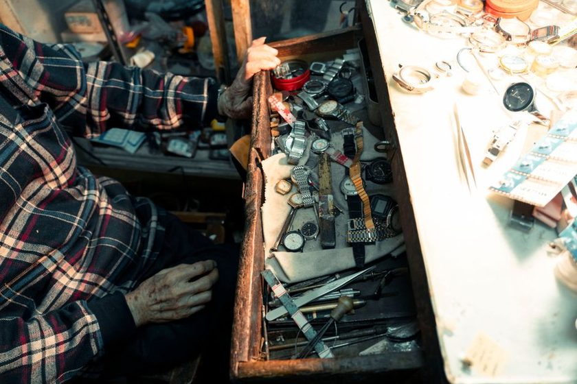 A partially open tool drawer with mixed contents